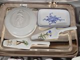 a silver tray with a variety of dishes and utensils in it