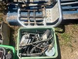 a pile of assorted items sitting on the ground