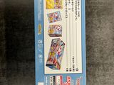 a box of pokemon trading cards sitting on a table