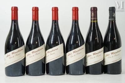 six bottles of red wine lined up in a row on a table