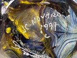 a close up of a glass bowl with writing on it