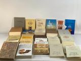 a lot of books that are sitting on a table