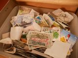 a box full of postage stamps sitting on top of a table