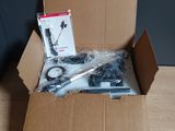a box with a remote control and other items in it