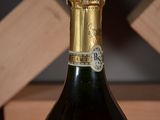 a bottle of wine that is sitting on a table