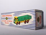 an old toy box with a green and yellow truck on it