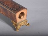 a small wooden box that has a hole in it