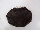 brown sued purse sitting on a white table next to a pair of scissors