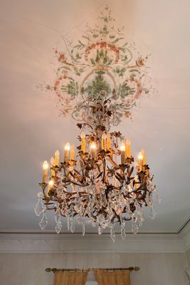a chandelier hanging from the ceiling in a room