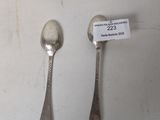 two spoons and a spoon with a tag on them