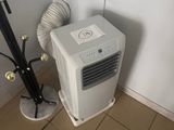 a small air conditioner in the corner of a room