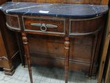 a small table with a marble top in a room