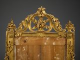 an image of a gold framed mirror on a white surface