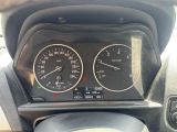 a close up of a car dashboard with various gauges