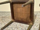a wooden box with a rope wrapped around it