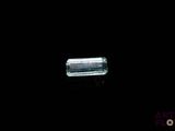 an image of a glass bottle on a black surface
