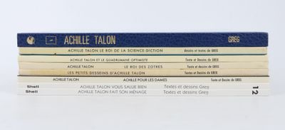 trois livres empilés sur une surface blanche