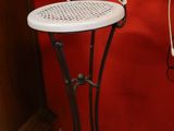 a white chair that is sitting in front of a red wall