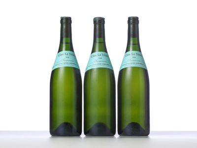 three bottles of wine sitting on top of a table next to each other
