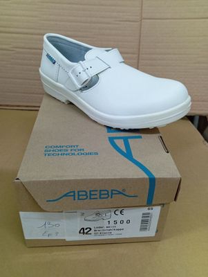 a white shoe that is sitting on top of a box