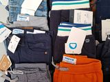 a pile of clothing that is sitting on a table