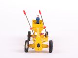 a small yellow toy tractor with a man sitting on it