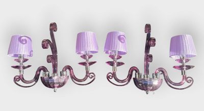 purple glass wall sconces with purple shades on them against a white background
