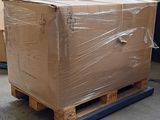 a large cardboard box on a pallet in a warehouse