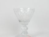 an image of a clear glass goblet sitting on top of a table