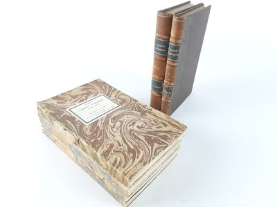 two books sitting on top of each other next to each other