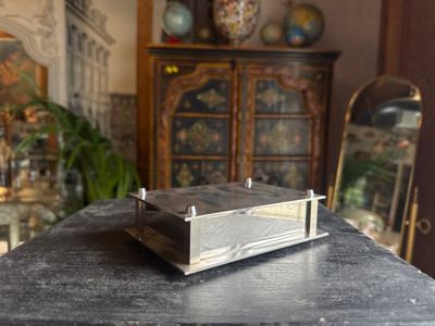 a small metal box sitting on top of a table