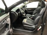 the interior of a car with the door open and the driver ' s seat down