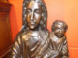a statue of a woman holding a child in her lap