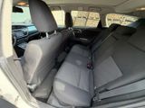 the back seats of a car are empty in the back of the car