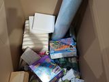 a cardboard box filled with many different items in it