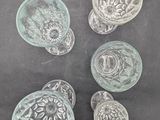 several pieces of glass sitting on top of a table next to each other