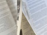 an open book that has a picture of a man on it