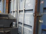 many containers stacked on top of each other next to each other
