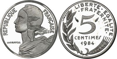 a close up of a coin with a woman ' s face on it