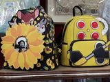 two backpacks that are sitting on a table