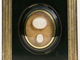 an image of a picture of a couple of coins in a picture frame