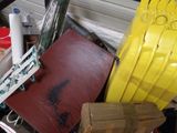 a pile of assorted items in a cluttered room