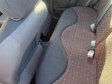 the interior of a car with the seat up and the front seats down