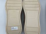 the soles of a pair of shoes are shown on a white surface