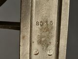 a close up of a piece of metal with a number on it