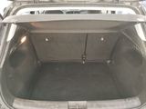 a trunk of a car that is empty with the door open