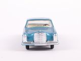 a toy car that is sitting on a white surface