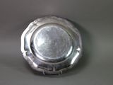 a silver plate that is sitting on a table