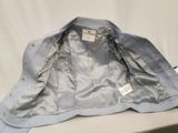 the jacket is blue and has a white label on it