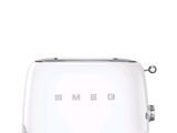 un grille-pain blanc sur lequel est inscrit « Smeg »